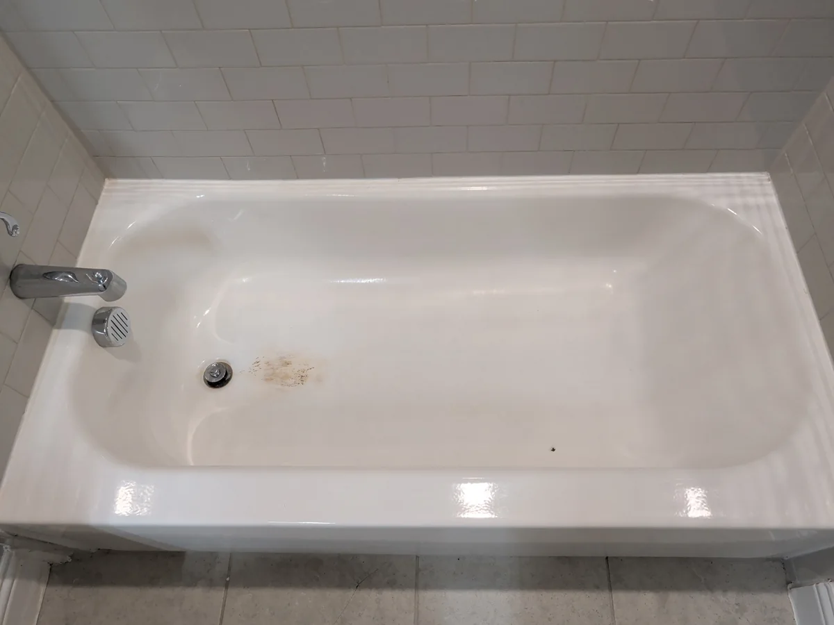 Wide view of damaged bathtub before repair in Allen, Texas
