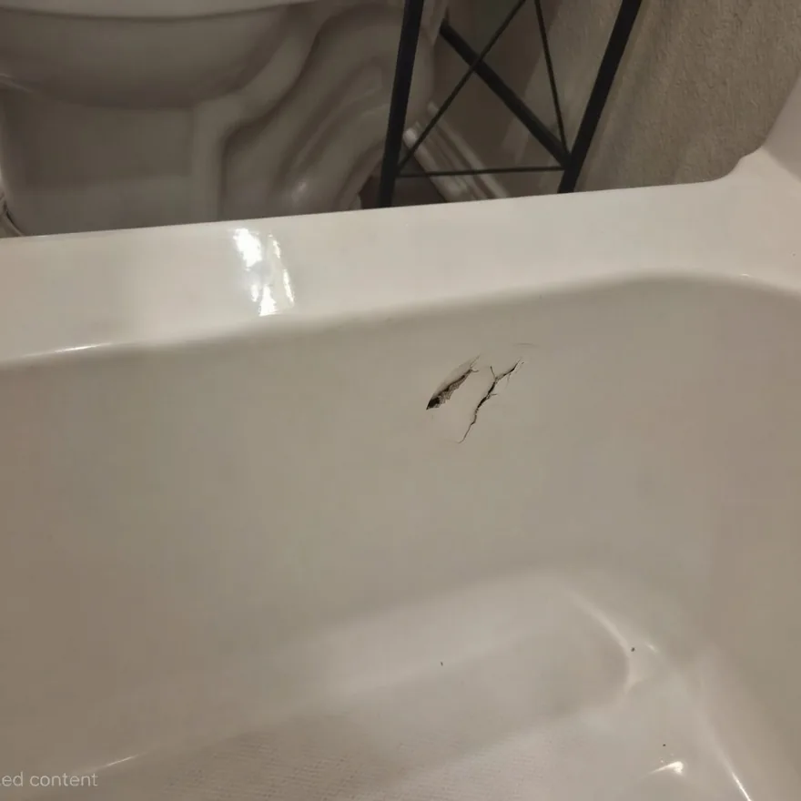 Close-up of tub hole or puncture damage