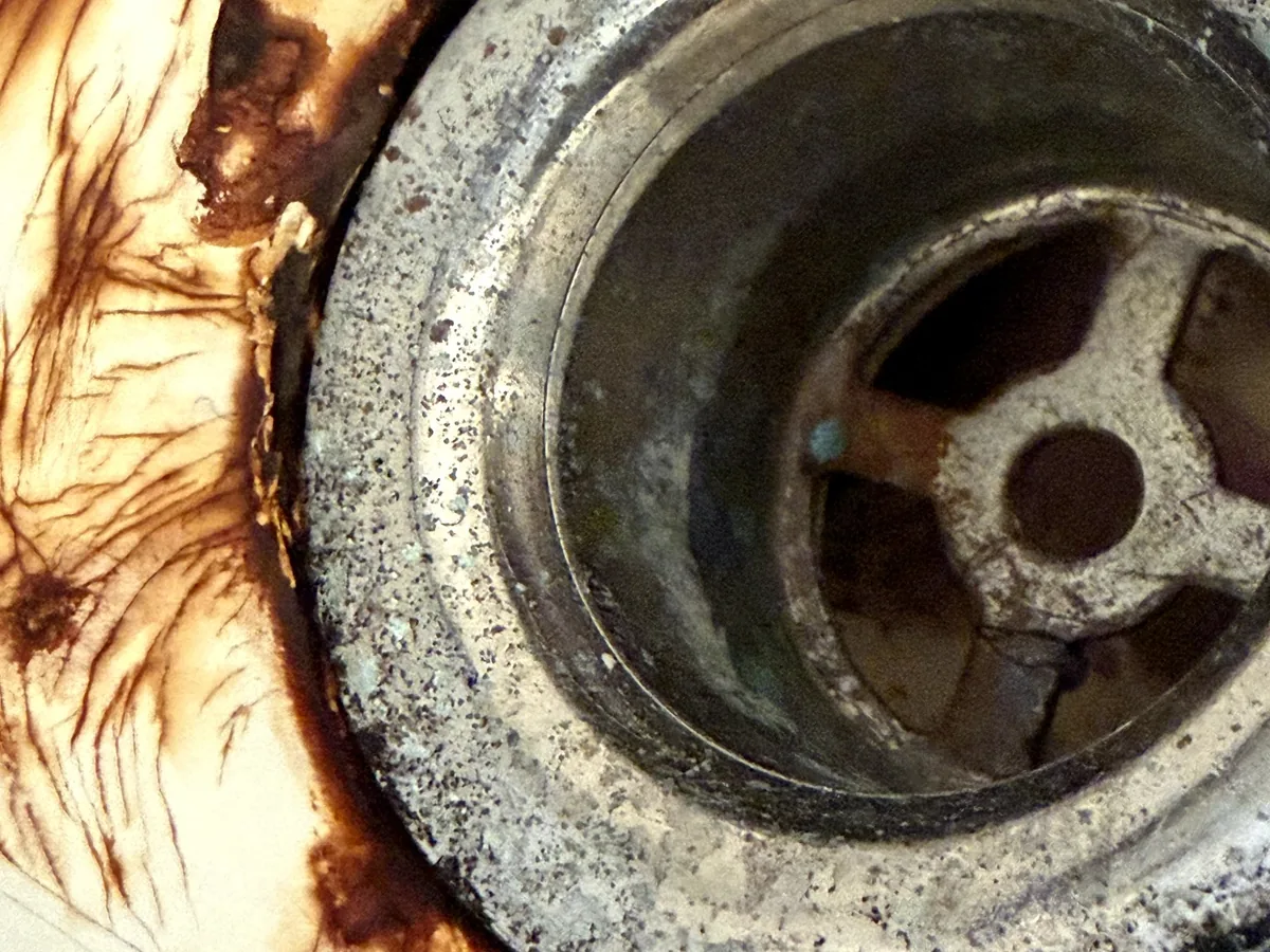Bathtub drain area after repair work in Garland, Texas