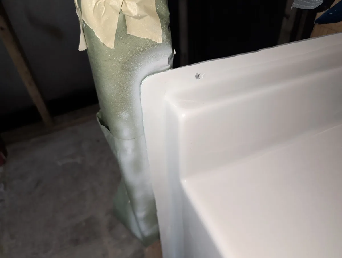 Fiberglass tub and shower corner after structural repair in Mesquite, Texas